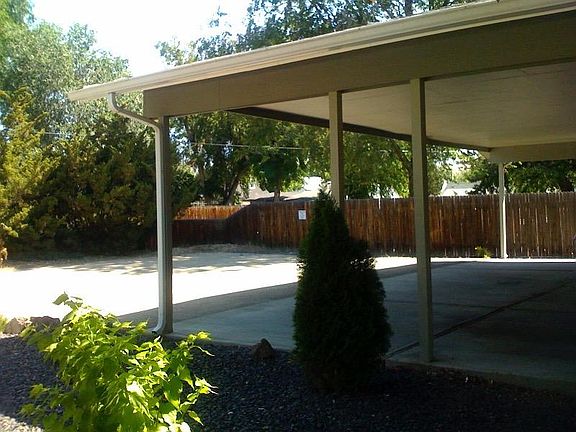 Covered carport with room for two cars