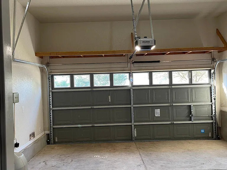 2 Car Garage has high ceilings, Windows for natural light, power opener (with open by phone app) Water Softener, Sprinkler System controls and huge wall to wall shelf for extra storage.
