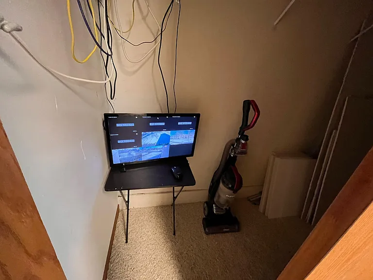 security camera with lighted gated drive way for parking