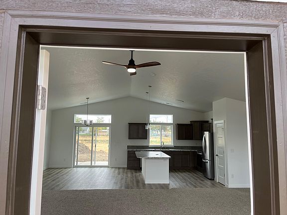 Front Room, Kitchen, Dining from front door of the home.