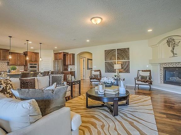 Gathering room features a cozy corner fireplace.