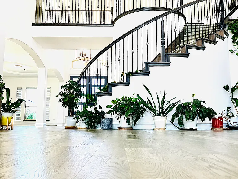 Graceful curved staircase leading from the living area