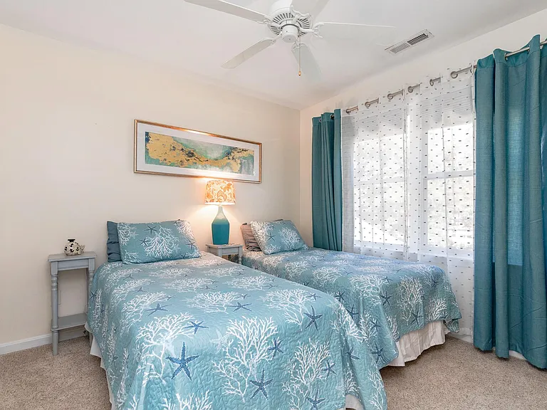 Twin beds in the third bedroom.