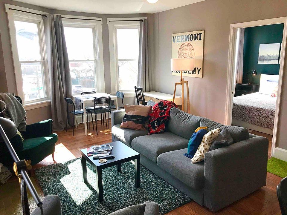 Living room and dining area with beautiful bay window