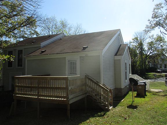 Back of residence with deck