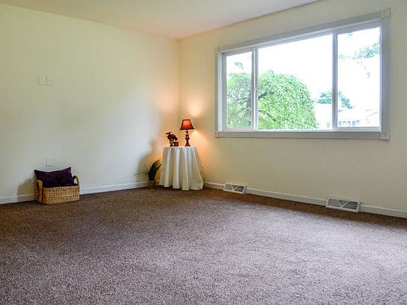 The large window flows the natural light throughout the space.