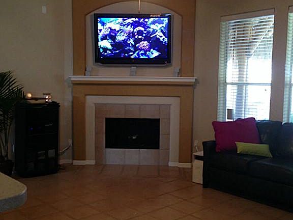 view of the corner wood burning fireplace