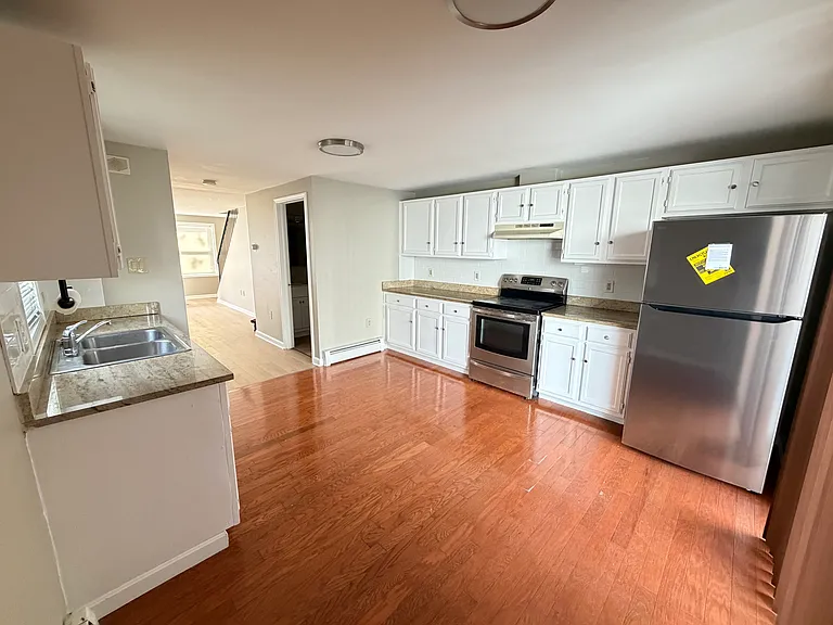 Kitchen w/ newly installed backsplash & breakfast nook