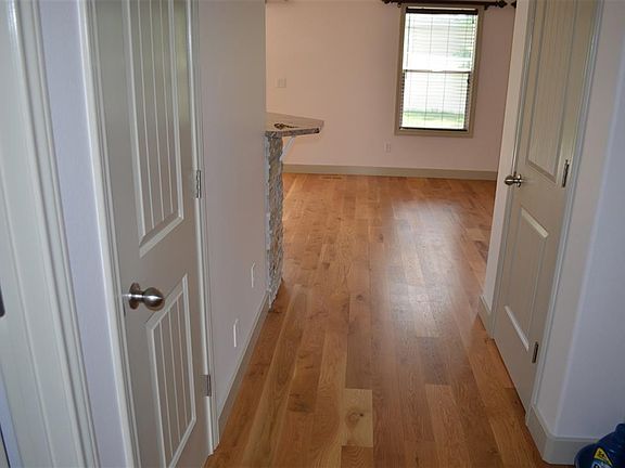 Entry to open concept living room & kitchen