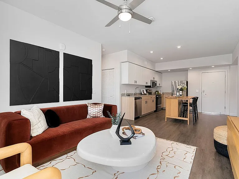 Step into this contemporary apartment combining elegance and functionality with a welcoming open-concept living area.