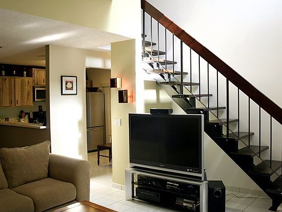 living - new custom hardwood stairs