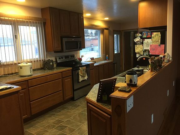 Open concept kitchen with updated stainless steel appliances