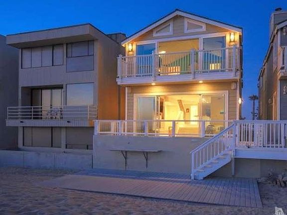 Patio right on the sand offers entertaining and outdoor dining options
