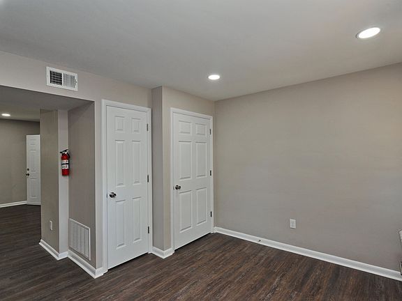 View from kitchen of apartment's front entrance, HVAC and closet (left to right).