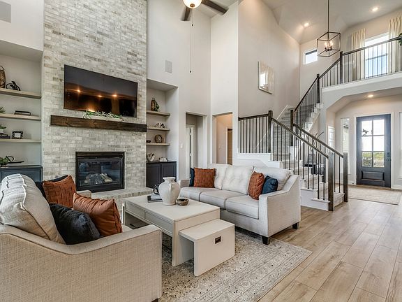 Living room and staircase of Berkshire Estates home in Mesquite, TX by Kindred Homes