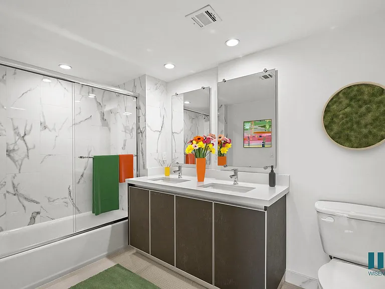 Large-Size Bathroom with Shower-Bath with a Glass Door and Vanity Cabinet Storage