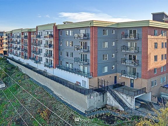 Unit #302 is the second from the bottom in the gray section of the building, left of the staircase.