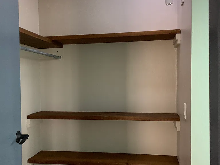 Walk through closet for Master bedroom.