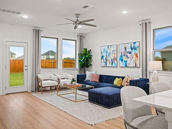 Living room in the Oak home plan by Trophy Signature Homes - REPRESENTATIVE PHOTO