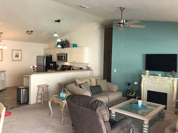 Living area -custom and electric blinds, flat screen and rec
