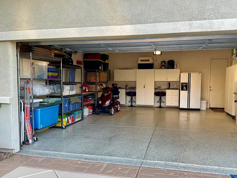 Spacious & insulated two-car garage with convenient extra refrigerator freezer!