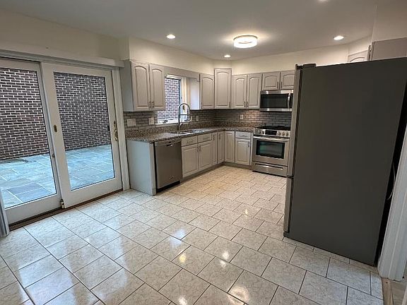 Kitchen and exit onto large snowy patio