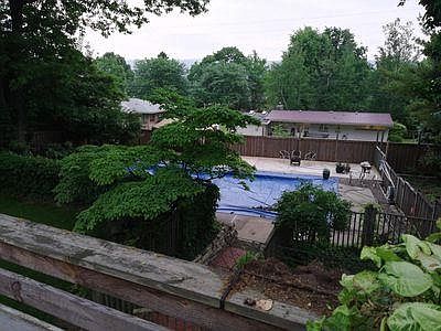 Pool area and pool deck from upper living room deck