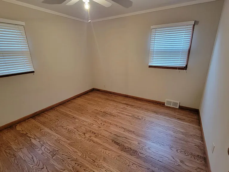 Bedroom 4 main floor w/refinishes HWF