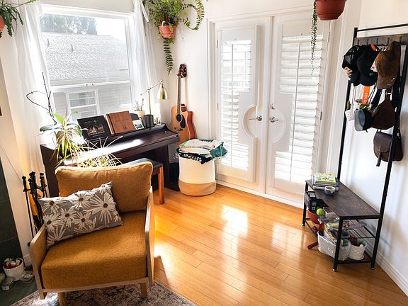This nook in the living room is a nice place for a piano or plants. The doors open onto the private deck.