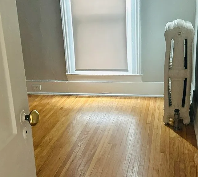 Middle Bedroom with Hardwood Floors