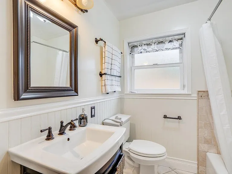 Hall bath with tub and stall shower