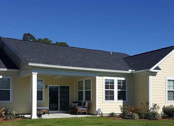 Back of house with covered back porch