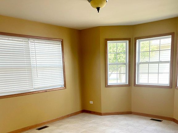 Spacious dinette, ample windows and natural light.