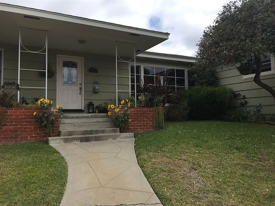 Corner lot with charming mid century style.  Over-sized porch for greeting guests, or sitting and relaxing