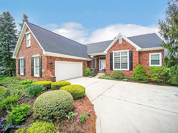 Low maintenance all brick hillside ranch.