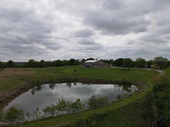 Large pond in front of house