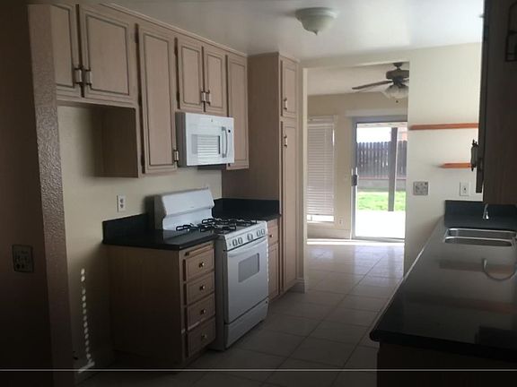Kitchen include microwave, dishwasher and stove.
