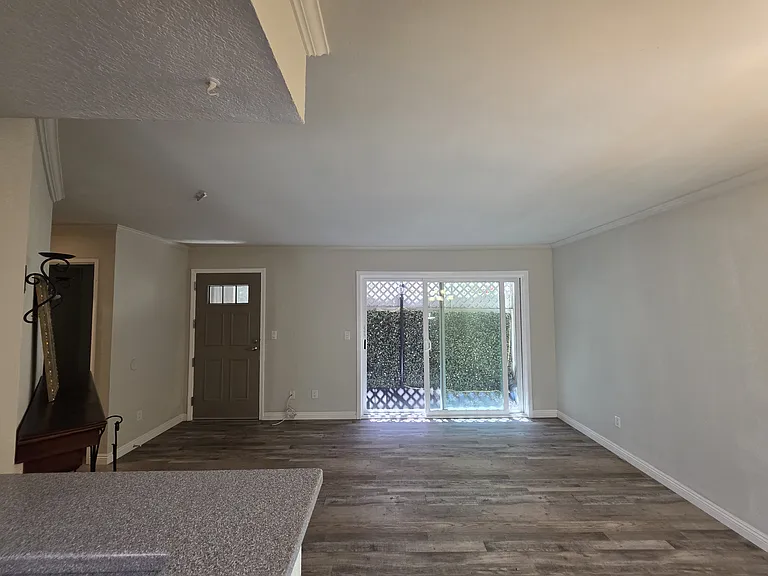 private patio through living room allows for natural breeze and light