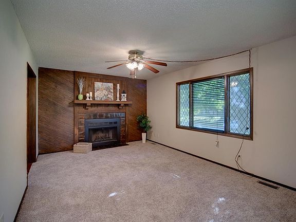 Spacious living room with woodburning fireplace