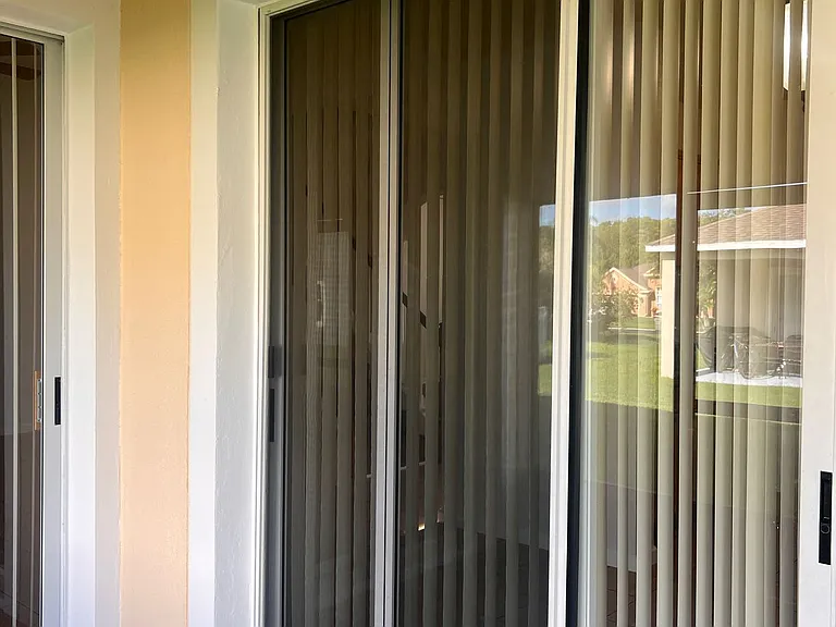 46 - Sliding doors opening to the screened patio.