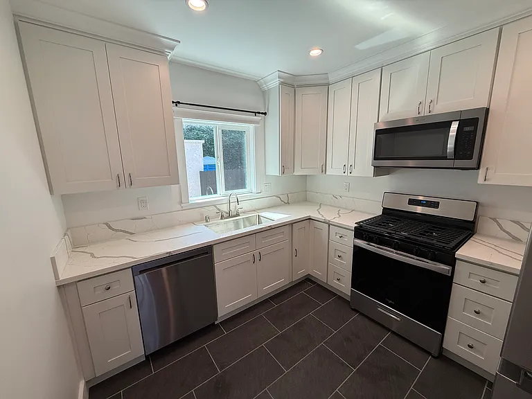 Extra Large Chef's Kitchen with All Major Brand Appliances, New Upgraded cabinets, Quartz countertops, Stainless Steel Undermount sink and New Slate Flooring