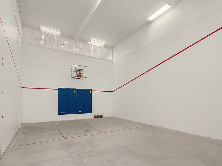 But, wait, there's more. An indoor squash court that could be used for a gym or drone practice