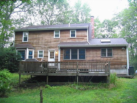 Back of house with deck