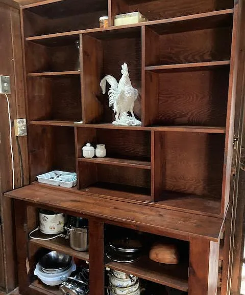 Lots of shelving in kitchen