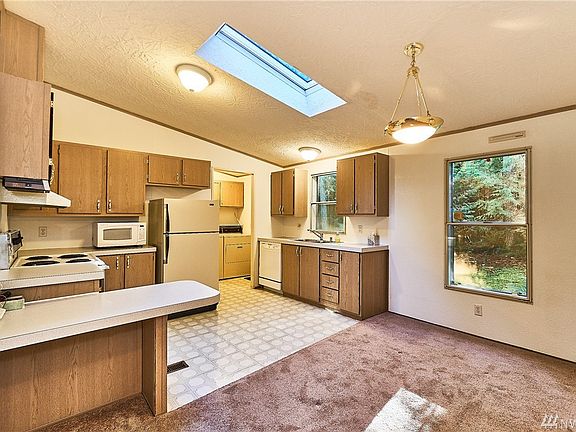 Easy flowing working kitchen with a nice work station or possible eating space.