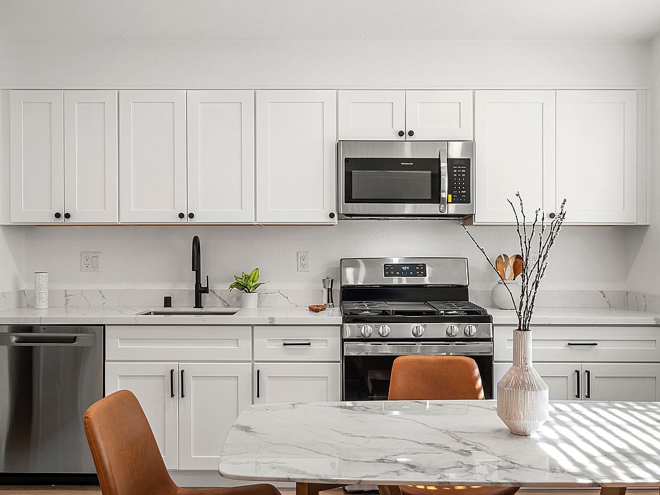 Open concept kitchen with sleek appliances