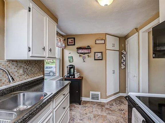 Kitchen includes built in Corner Pantry and Door to basement