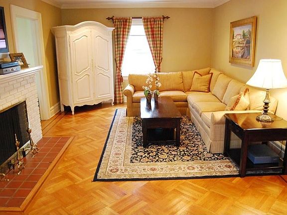 Living Room with parquet floors & wood burning fireplace
