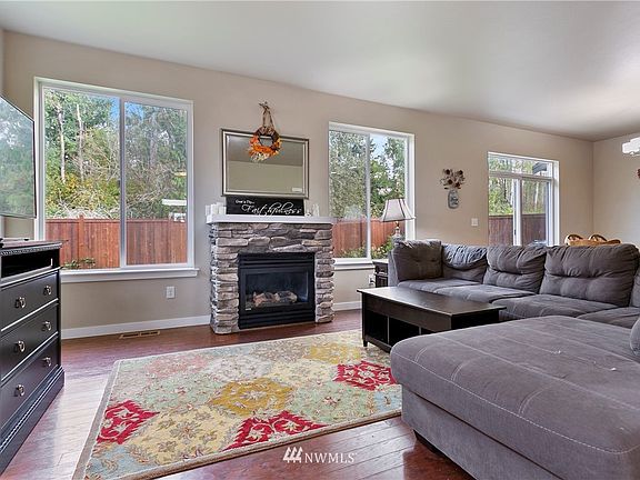 Large picture windows span the back of the home letting in loads of natural light.