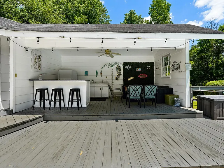 Pool house lounge with outdoor kitchen (sink only usable in summer pool season)
